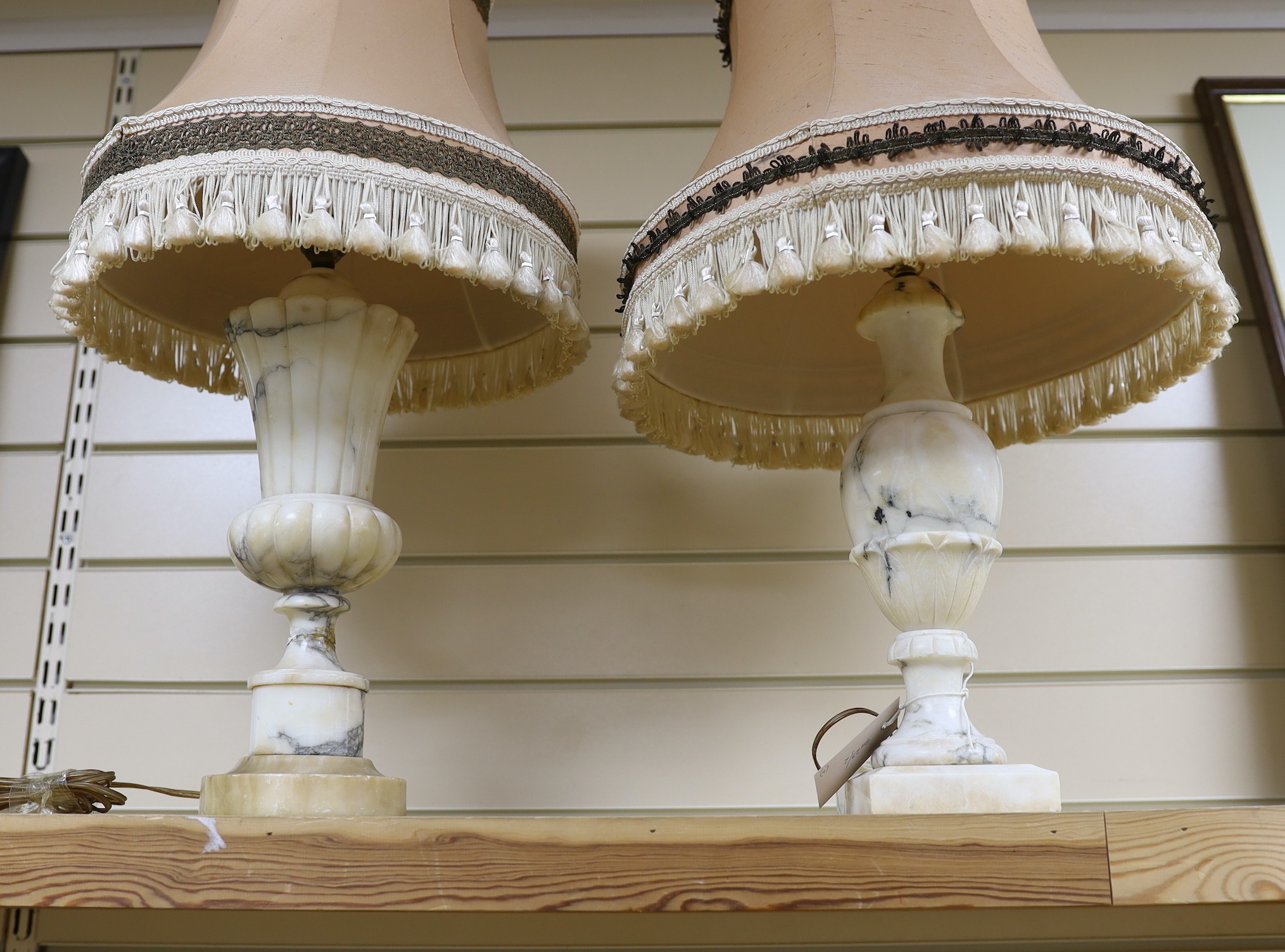 Two alabaster table lamps, 32cms high not including shades and fittings